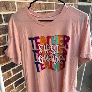 Women's Pink 'First Grade Teacher' Graphic Tee